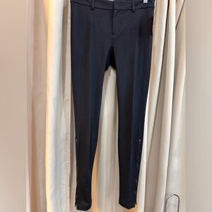 Vince black skinny pants with zippers.